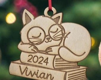 cat ornament, cat christmas, cat on books, book ornament, book christmas ornament, cat with glasses, cat reading, cat glasses, cat with glas