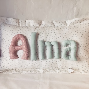 Cushion cloud personalized with name.