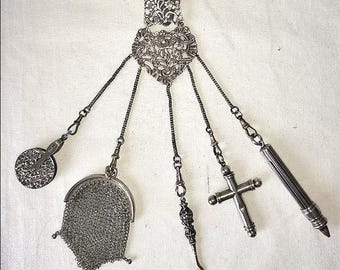 Antique silver chatelaine with 5 chains, Victorian chainmail purse, button hook, large cross, purple pin cuchion wheel and pencil holder.