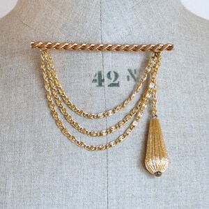 Wide gold tone metal brooch - dangling chains & pompom pin - 1980s statement costume jewellery - French 80s vintage