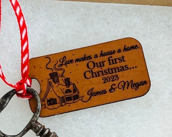 Love makes our house a home. First Christmas together leather ornament