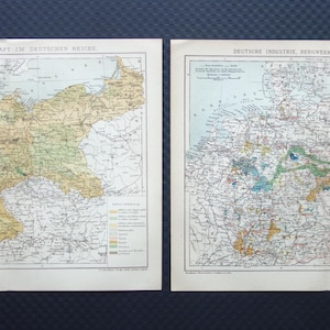 Può includere: Due mappe d'epoca della Germania, affiancate, con cartografia dettagliata. La mappa a sinistra si concentra sull'agricoltura, con regioni codificate a colori. La mappa a destra evidenzia l'industria e le risorse, anch'esse con aree codificate a colori. Entrambe le mappe hanno testo in tedesco.