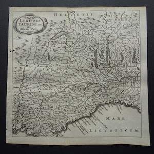 May include: A vintage black and white map of Ligures Taurini, a region in Italy, with the text "LIGURES TAURINI, etc.  Rhaetie Pars." at the top. The map shows the region's rivers, mountains, and towns.