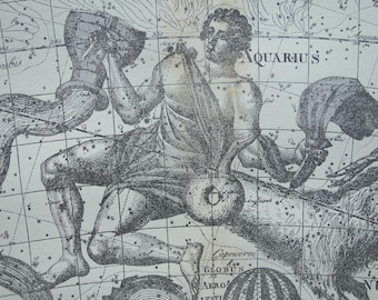 May include: A black and white celestial map print featuring the Aquarius constellation. The illustration depicts a figure pouring water from a vessel, surrounded by a grid of stars and lines, with the text AQUARIUS and Capricorni visible.
