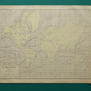 May include: An antique world map, featuring continents in beige and oceans in a lighter hue. The map includes labeled currents and the title "PLANISPHERE" in bold text. The map is framed with a dark border.