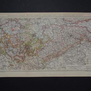 May include: Antique map of the Kingdom of Saxony, Province of Saxony, Southern Part, and Thuringian States. The map features detailed geographical information with various colors and text, printed on aged paper.
