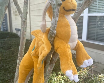 Golden floppy dragon plush