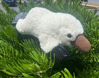 Peluche di ornitorinco in diversi stili