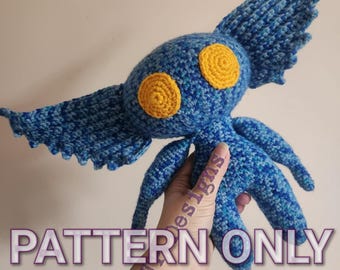 May include: Crochet pattern for a blue and yellow amigurumi creature with large eyes and wings. The pattern is for sale, the finished product is not included. "PATTERN ONLY" is written in purple text on the image.