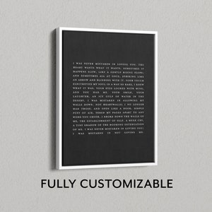 May include: A rectangular framed canvas wall art piece featuring a black background with white printed text that reads: I WAS NEVER MISTAKEN IN LOVING YOU, THE HEART WANTS WHAT IT WANTS. SOMETIMES IT HAPPENS SLOW, LIKE A GENTLY RISING SLOPE.