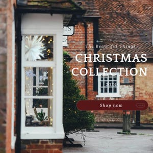 May include: A shop front with a Christmas tree in front of it. The shop front has a sign that says "The Beautiful Things Christmas Collection 2024". There is a button that says "Shop now" with an arrow.