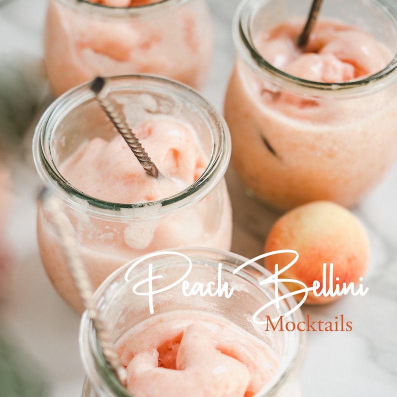 May include: Four glass jars filled with a pink peach puree drink, with a peach on the table and the text "Peach Bellini Mocktails" in white.