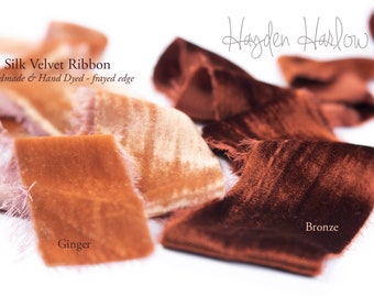 May include: Silk velvet ribbon in two colors: ginger and bronze. The ribbon is handmade and hand-dyed with a frayed edge. "Silk Velvet Ribbon" and "Handmade & Hand Dyed - frayed edge" are written in the top left corner. "Ginger" is written below the ginger ribbon and "Bronze" is written below the bronze ribbon.