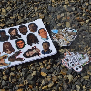 May include: A sheet of stickers featuring characters from the TV show "The Office" and a separate sheet of stickers featuring characters from the movie "The Nightmare Before Christmas".