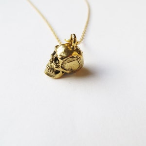 Skull Necklace, gold skull charm, skull pendant, human body, trending jewellery, latest fashion, gold chain, birthday gift