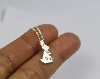 May include: A silver necklace with a rabbit pendant. The rabbit is sitting up with its ears perked up.