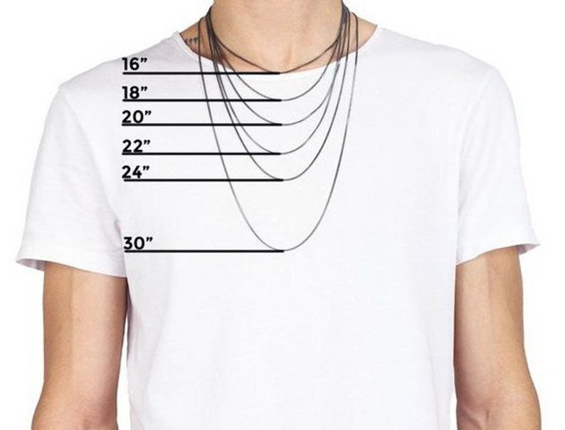 May include: A white t-shirt with a model wearing a black chain necklace. The necklace is shown in different lengths, from 16 inches to 30 inches.
