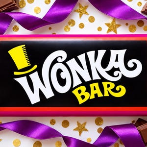 May include: A rectangular chocolate bar wrapped in a black, pink, and orange paper label featuring the white text Wonka Bar and a yellow top hat icon. The bar is surrounded by purple satin ribbon, gold star confetti, and chocolate pieces.