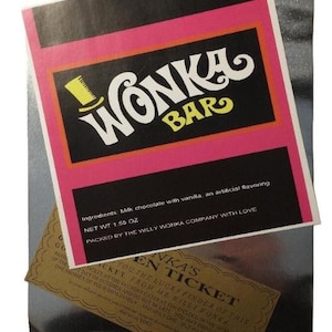 May include: A gold and brown Willy Wonka chocolate bar wrapper with a pink and black Wonka Bar logo. The wrapper has the text "Ingredients: Milk chocolate with vanilla, an artificial flavoring. Net Wt 1.55 oz. Packed by the Willy Wonka Company with Love."  A golden ticket is partially visible underneath the wrapper. The ticket has the text "Wonka's Golden Ticket You the lucky finder of this ticket from Mr Willy Wonka".