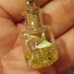 Tiny origami crane in a glass bottle Antique Bronze Necklace