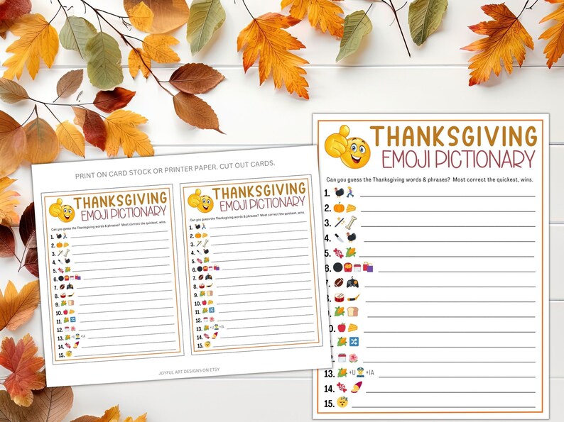 May include: Two printable Thanksgiving Emoji Pictionary game cards. Each card has 15 lines with an emoji next to each line. The text on the card reads "Thanksgiving Emoji Pictionary" and "Can you guess the Thanksgiving words & phrases? Most correct the quickest, wins."
