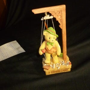 May include: A set of three ceramic mugs with a speckled, matte finish. The mugs are in shades of cream, light gray, and dark gray. Each mug has a simple, minimalist design, perfect for coffee or tea.