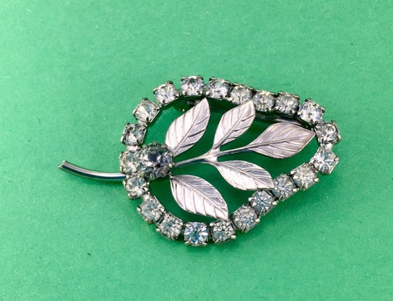 Rhinestone Brooch With Silver Leaves - image 1