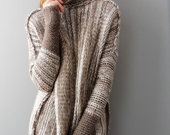 May include: A brown and white striped knit sweater with a turtleneck and long sleeves. The sweater has a relaxed fit and is made of a soft, cozy material.