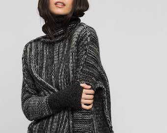 May include: A black and gray striped turtleneck sweater with long sleeves and a loose fit.