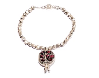 Silver bracelet with pomegranate-shaped pendant