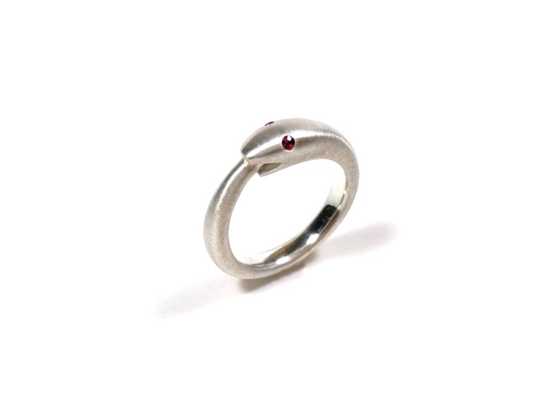 Silver Uroboros ring witha ruby snake biting its tail symbol of infinite rebirth