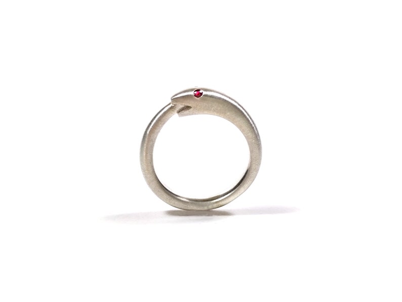 Silver Uroboros ring witha ruby snake biting its tail symbol of infinite rebirth