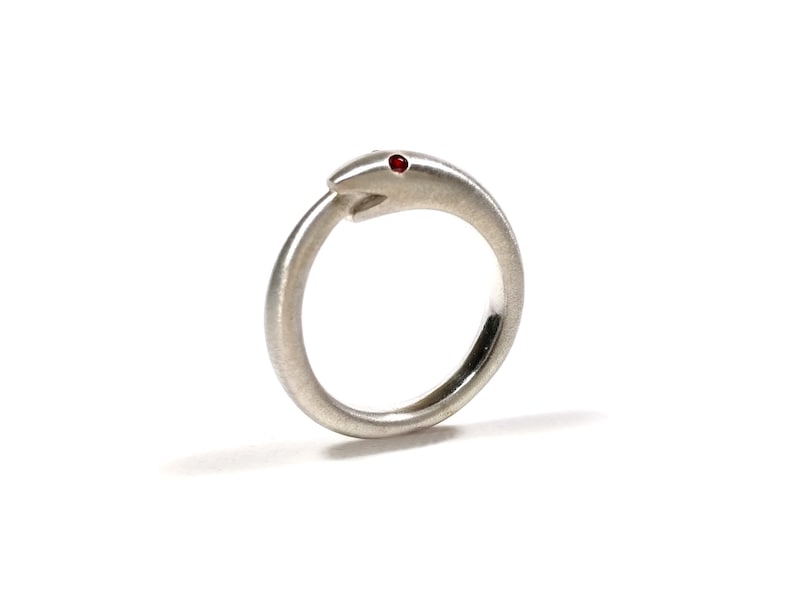 Silver Uroboros ring witha ruby snake biting its tail symbol of infinite rebirth