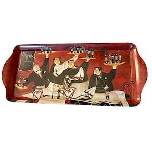 May include: A rectangular serving tray with a deep red background featuring an illustration of four waiters in black suits and white aprons carrying trays of wine bottles. A sign on the left side displays the text Le MENU! Wine Tasting.