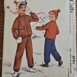 May include: Vintage McCall's sewing pattern for girls' and boys' ski jacket and pants. The illustration shows two children building a snowman. The pattern cover features the number 4791 and the size 6.