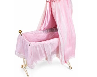 Vintage wicker crib with pink drapes display large doll collectors prop