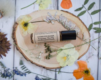 Under Eye Elixir • Pomegranate + Rose Hip • The Quintessence of Flora • Intended to tone, brighten, hydrate, tighten & reduce puffiness