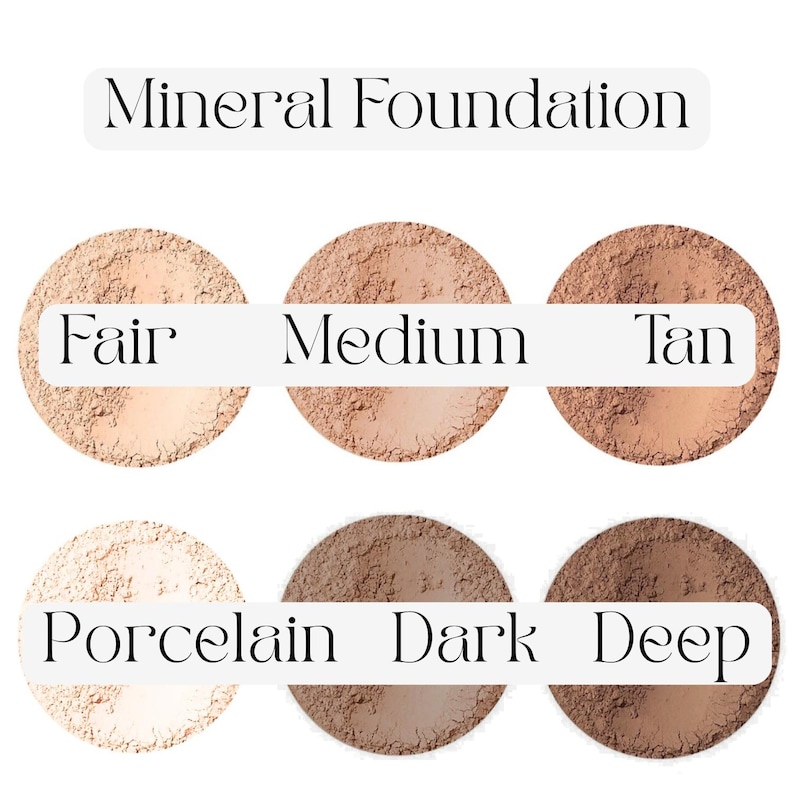 May include: Image of six shades of mineral foundation, ranging from Fair to Deep. The shades are labelled Medium and Tan, with the text "Mineral Foundation" above. The foundation is in circular containers.