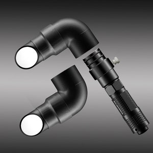 May include: Black flashlight with the text "M10 Maverick" and two black 90-degree elbow connectors with white circular openings. The flashlight is positioned between the connectors, suggesting a possible connection or assembly.