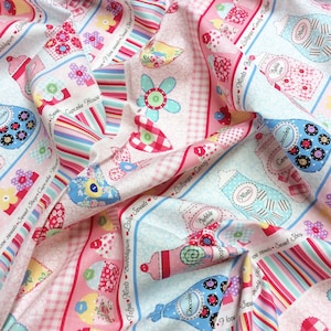 May include: A pink and blue fabric with a repeating pattern of jars and bottles filled with sweets. The jars and bottles have labels with different sweet names, such as "Lollipops Candy", "Toffees Mints Bubblegum", "Bubble Gum", "Mints", and "Chocolate". The fabric also features hearts, flowers, and stripes.