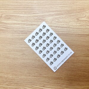 May include: A sheet of white paper with black ship stickers. The stickers are arranged in rows and columns. The text "lethbridgepaper co uk" is printed in the bottom right corner.