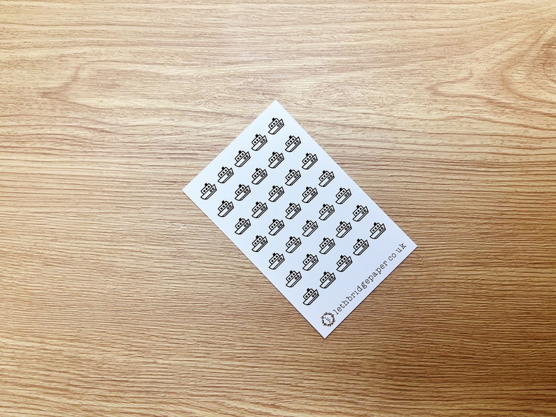 May include: A sheet of white paper with black ship stickers. The stickers are arranged in rows and columns. The text "lethbridgepaper co uk" is printed in the bottom right corner.