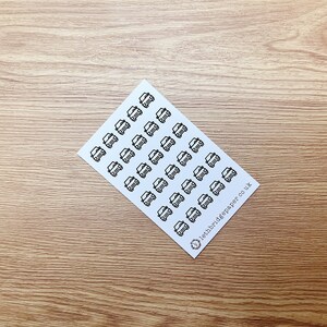 May include: A sheet of white paper with black car stickers. The stickers are arranged in a grid pattern. The text "letbridgepaper.co.uk" is printed in the bottom right corner.