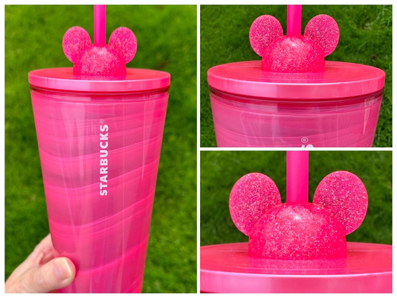 May include: Pink Starbucks tumbler with a glittery Mickey Mouse lid and a straw. The tumbler has a swirl design and the Starbucks logo is printed on the side.