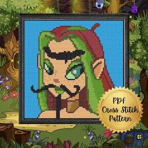 May include: Cross stitch pattern PDF featuring a cartoon elf with green hair, red and green clothing, and a black mustache. The elf has large green eyes and a mischievous expression. The pattern is framed in a black frame and set against a blue background.