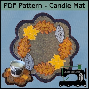 May include: A PDF pattern for a candle mat featuring a scalloped edge, decorated with appliqued felt leaves in shades of yellow, orange, and gray. The design includes a large mat and a smaller matching coaster, both with visible blanket stitching.