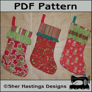 May include: Three Christmas stockings with different designs. The stocking on the left has a gingerbread man pattern, the middle stocking has a red and green floral pattern, and the stocking on the right has a red and white snowflake pattern. The stockings are all made with a red fabric and have a green trim.