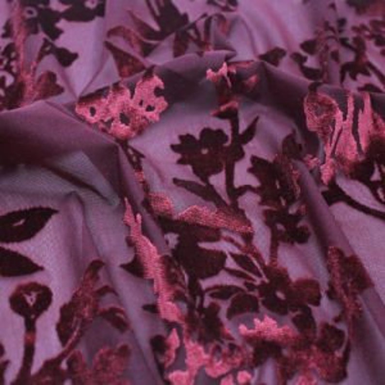 May include: Burgundy sheer fabric with a raised velvet floral pattern.