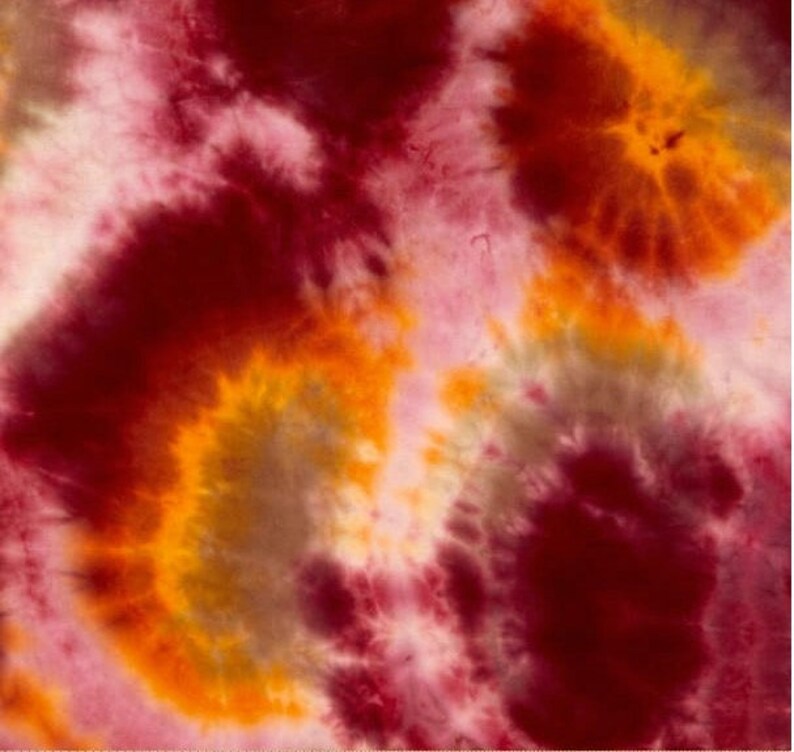 May include: Abstract tie-dye pattern in shades of red, orange, yellow, and white. The colors swirl and blend together to create a unique and eye-catching design.