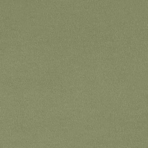 May include: A close-up of a textured, green fabric. The fabric has a subtle sheen and a slightly rough texture.
